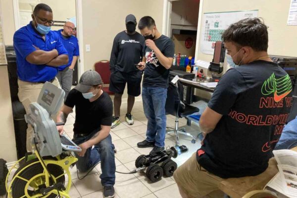 people working on some equipment